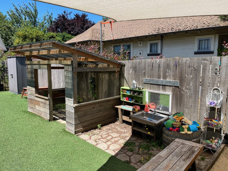 Outdoor mud kitchen and sandbox toys.