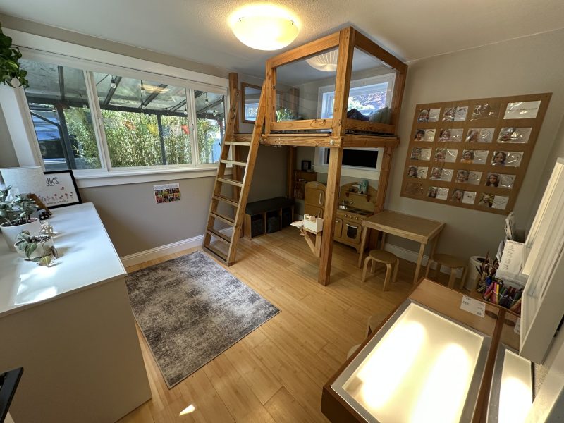 Loft room with a kids loft, light table and little kitchen.