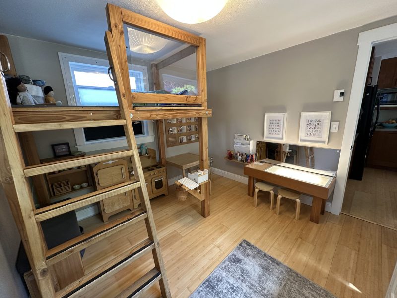 Loft room with a kids loft, light table and little kitchen.